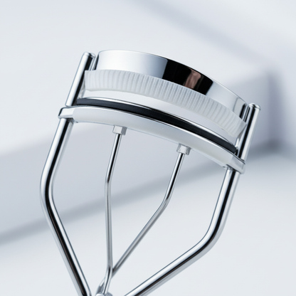 Eyelash curler clamp mechanism – macro detail shot