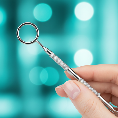 Close-up hand holding blackhead extractor – teal macro shot