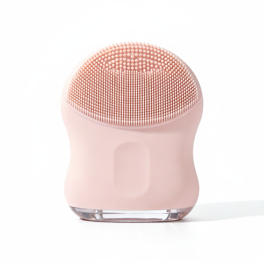 Pink silicone facial brush – white background studio shot