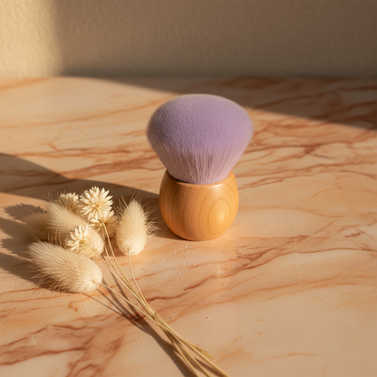 Lavender kabuki brush on peach terracotta marble with pampas grass