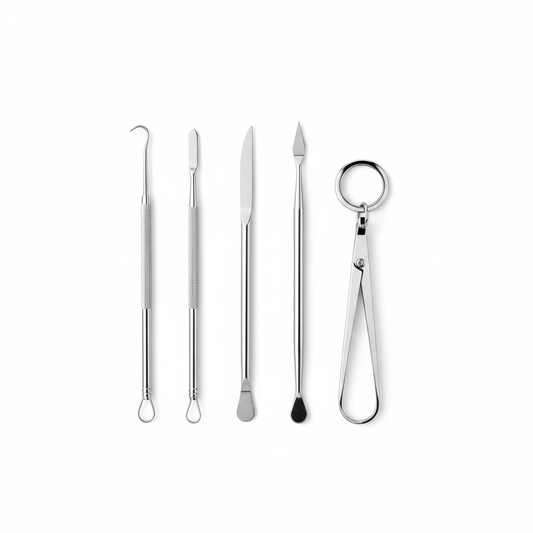 Stainless steel skincare tools white background