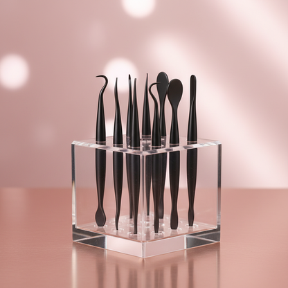 Skincare tools in acrylic stand on rose gold surface